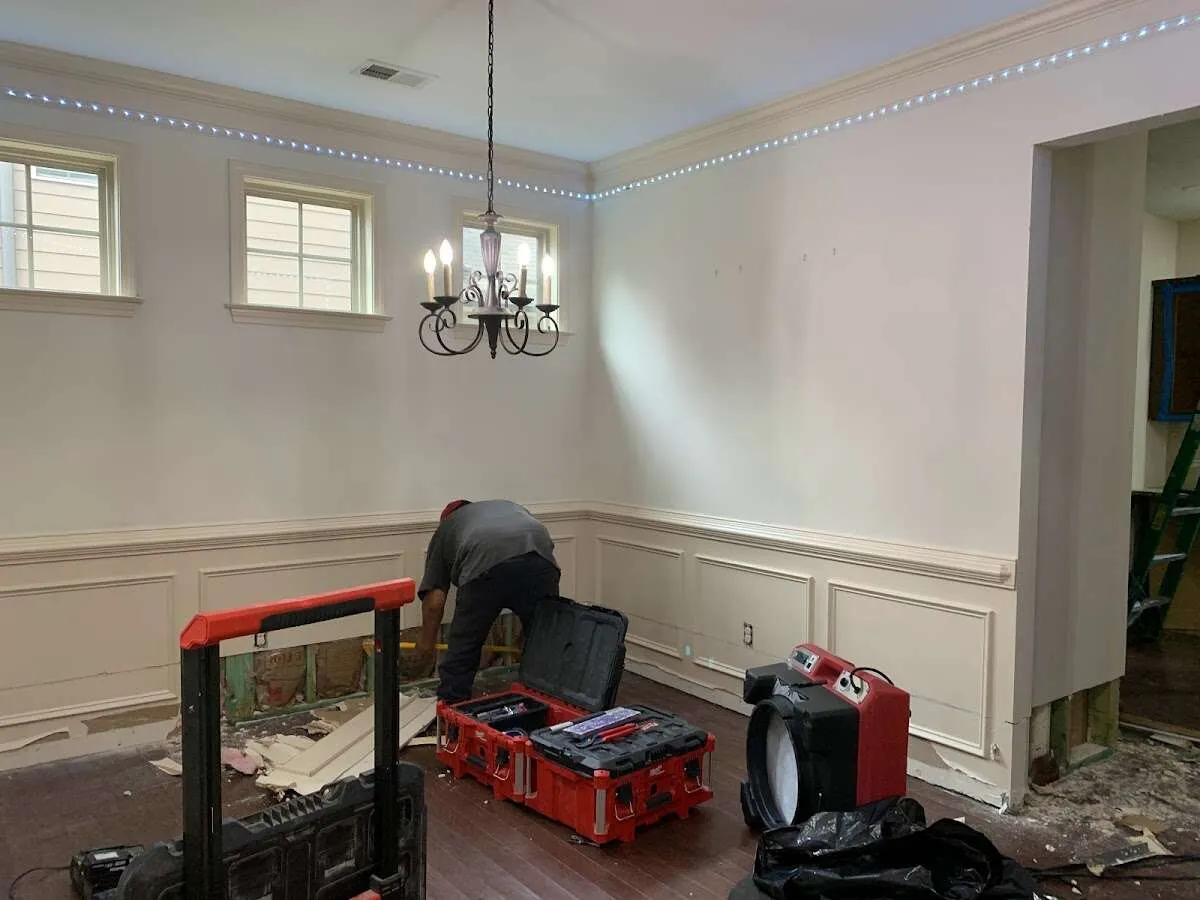 Restoration technician with professional equipment in Covington